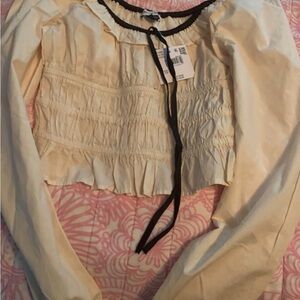 American Eagle Outfitters Tan Smocked Crop Top off shoulders.